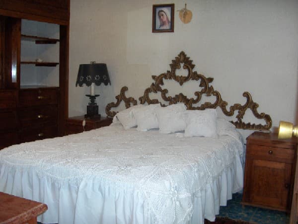 A private room in a homestay, with all meals included