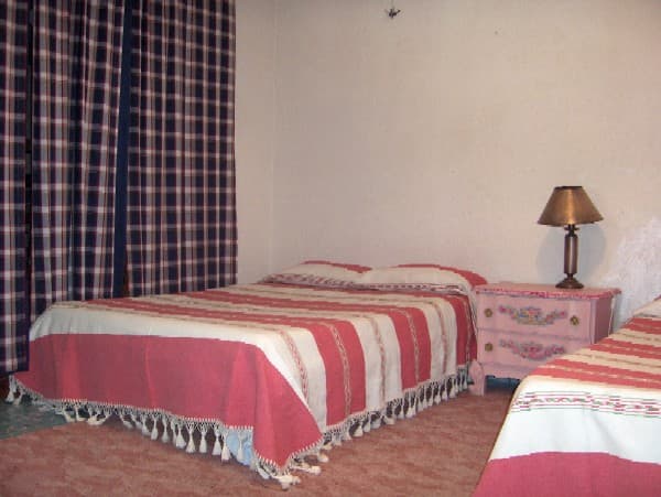 A double room in a homestay, with all meals included